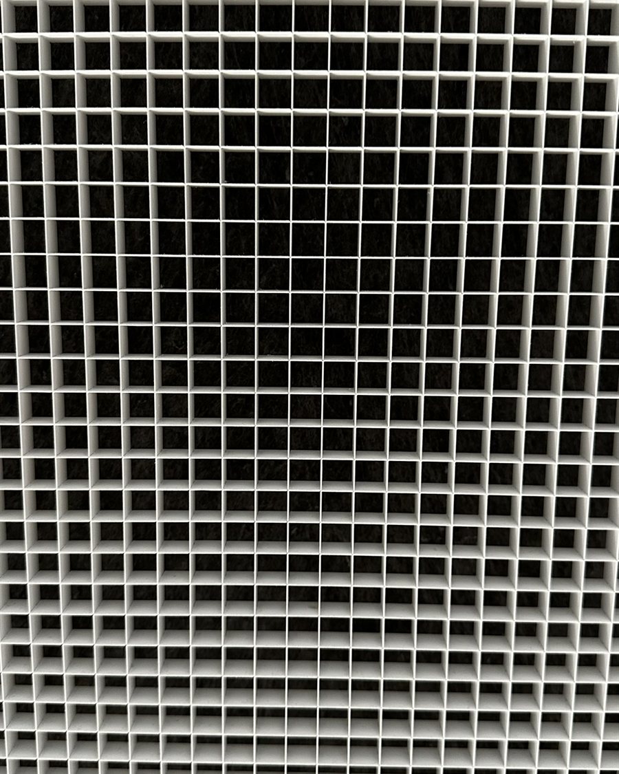 Return-air filter grille cleaned back to bright white after servicing